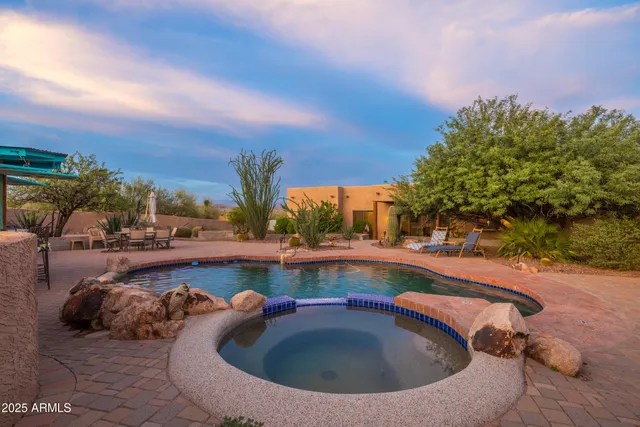 a view of a house with basket ball court