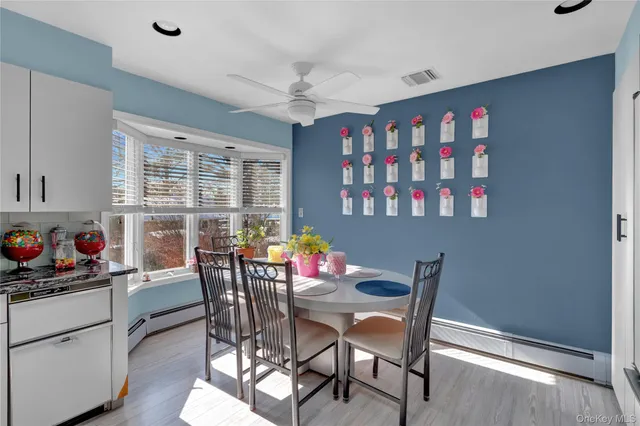 a bedroom with a bed gym equipment and a large window
