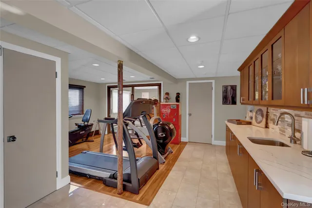 a view of a patio with couches and table and chairs and potted plants