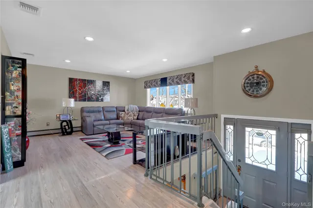 a kitchen with stainless steel appliances granite countertop a stove a sink dishwasher a microwave oven and a refrigerator