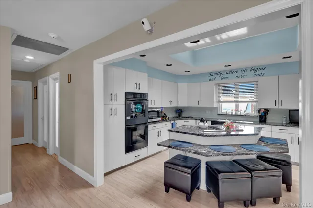 a bedroom with a large bed and a ceiling fan