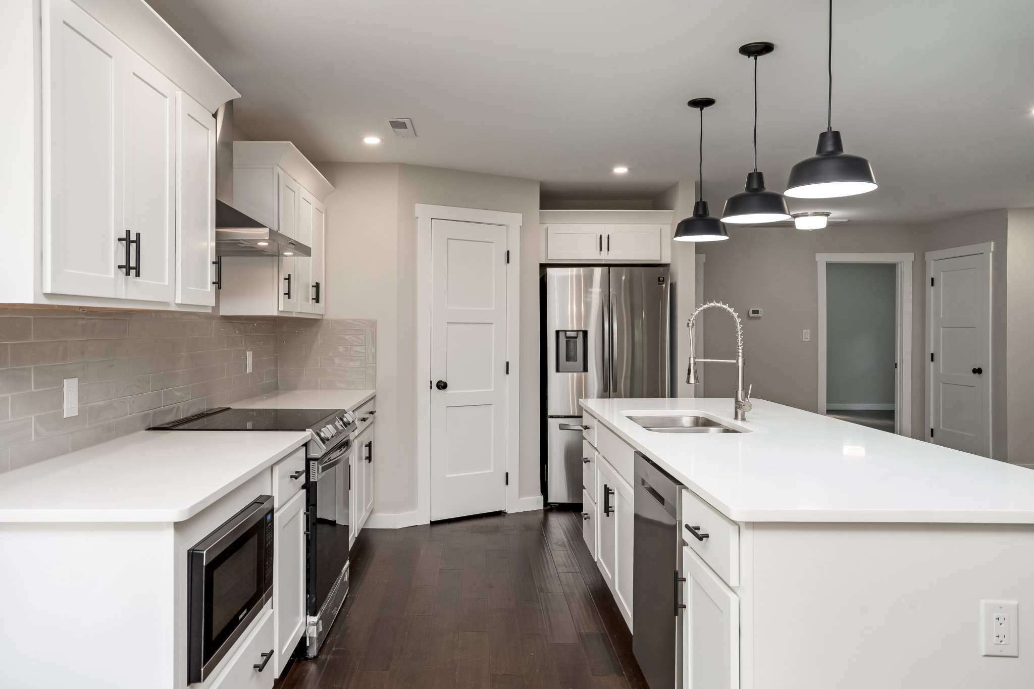 4048 Skelley Road Santa Fe, TN 38482 - Photo 13 of 43 a kitchen with a stove a sink and a refrigerator