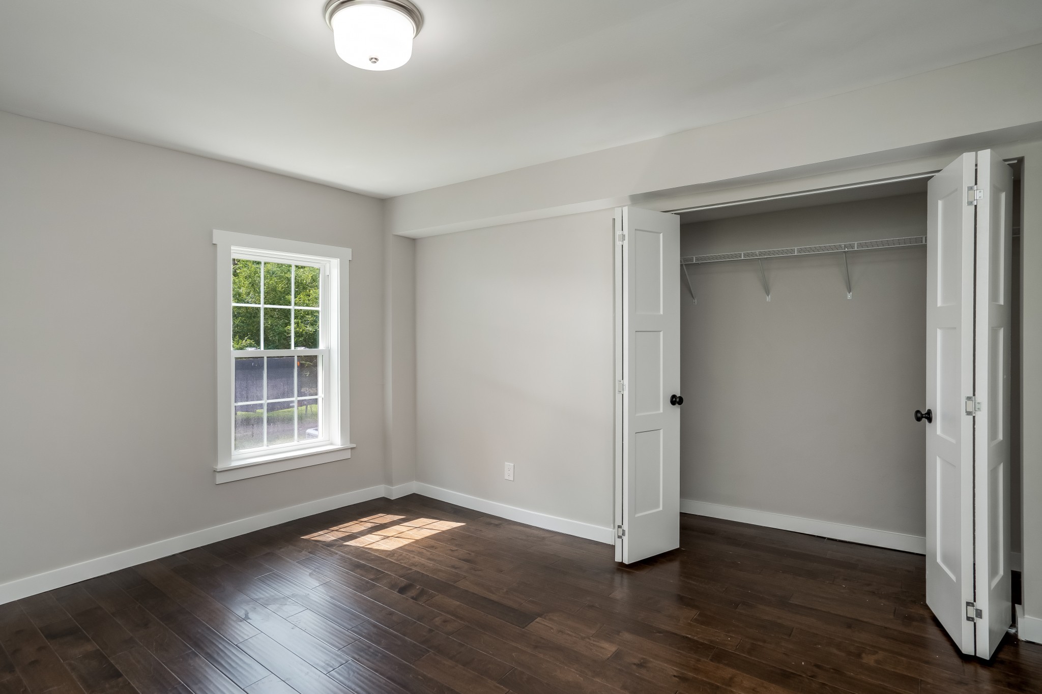 4048 Skelley Road Santa Fe, TN 38482 - Photo 24 of 43 an empty room with wooden floor and windows