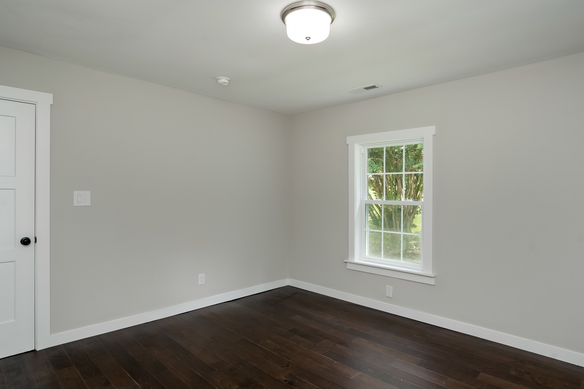 4048 Skelley Road Santa Fe, TN 38482 - Photo 26 of 43 an empty room with wooden floor and windows