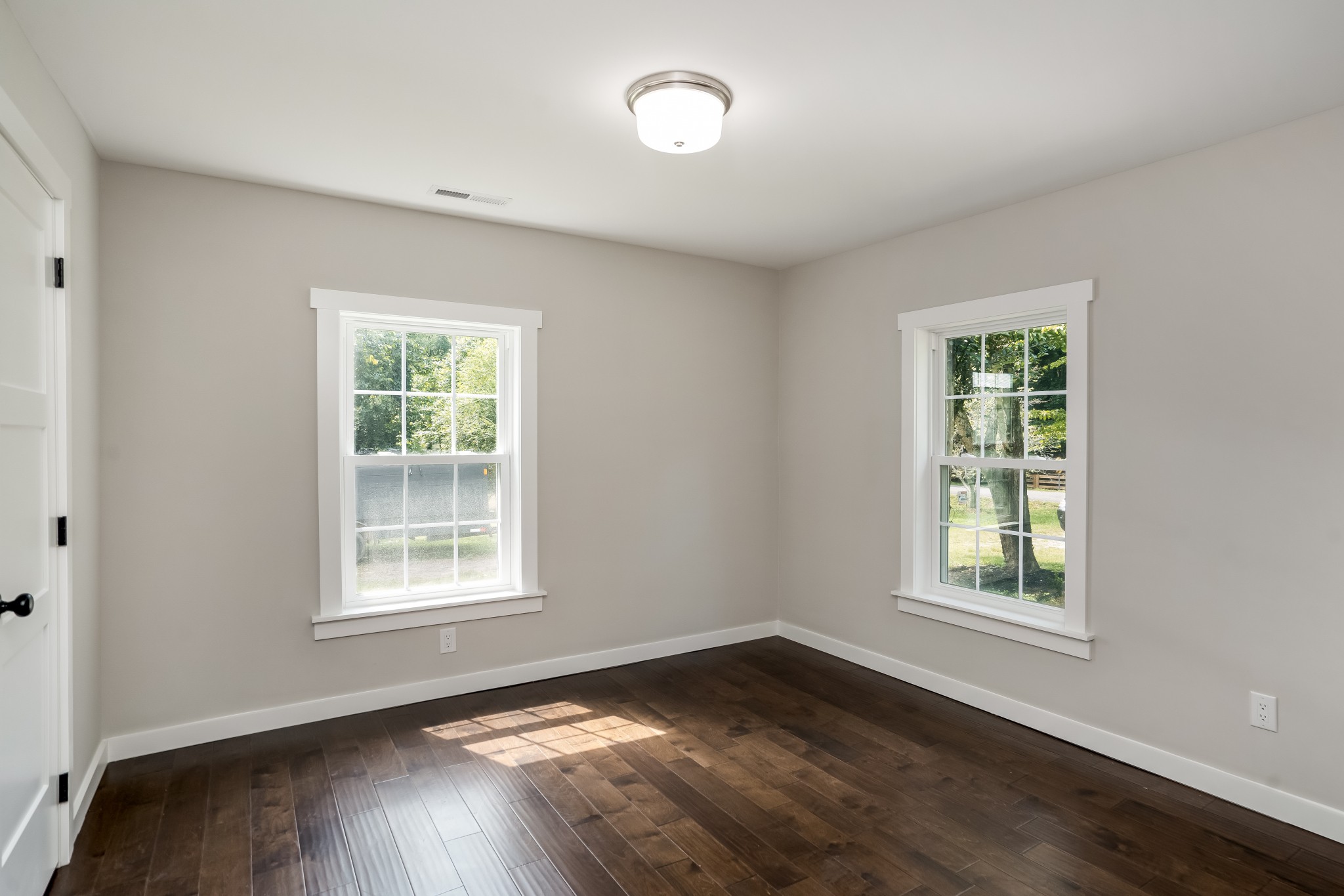 4048 Skelley Road Santa Fe, TN 38482 - Photo 27 of 43 a view of an empty room with wooden floor and a window