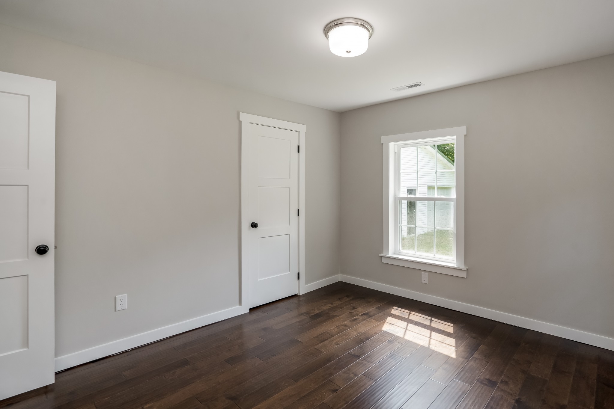 4048 Skelley Road Santa Fe, TN 38482 - Photo 28 of 43 an empty room with wooden floor and windows