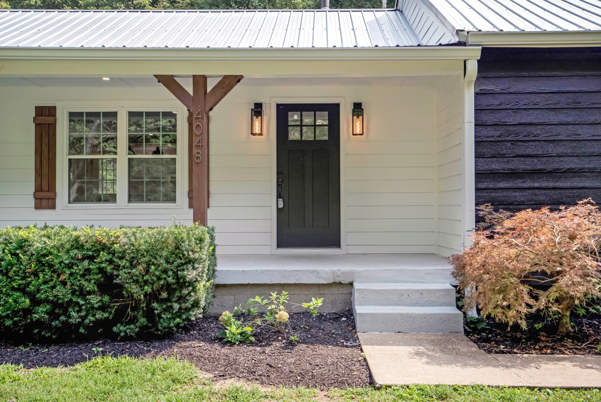 4048 Skelley Road Santa Fe, TN 38482 - Photo 4 of 43 a front view of a house with garden