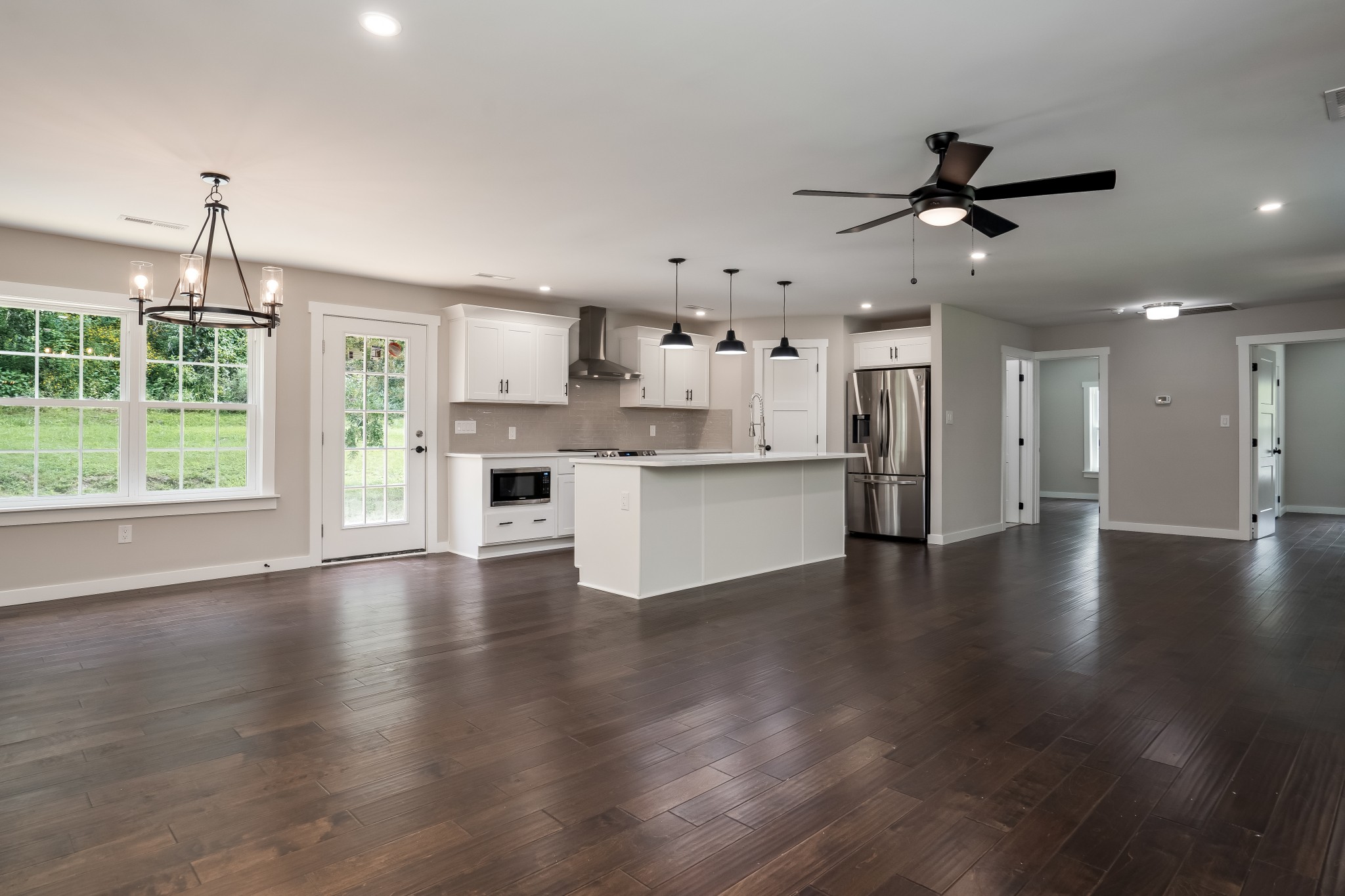 4048 Skelley Road Santa Fe, TN 38482 - Photo 7 of 43 a view of a kitchen with a kitchen island wooden floor and a window