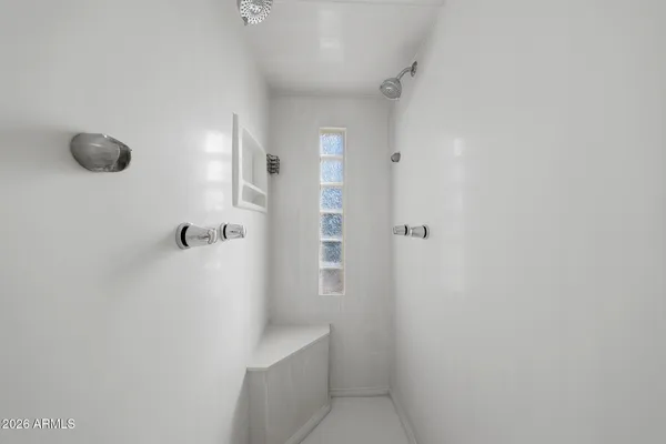a bathroom with a toilet sink and shower