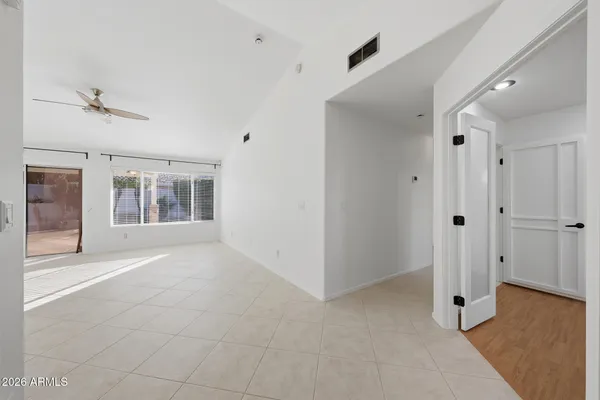 a big room with closet and windows