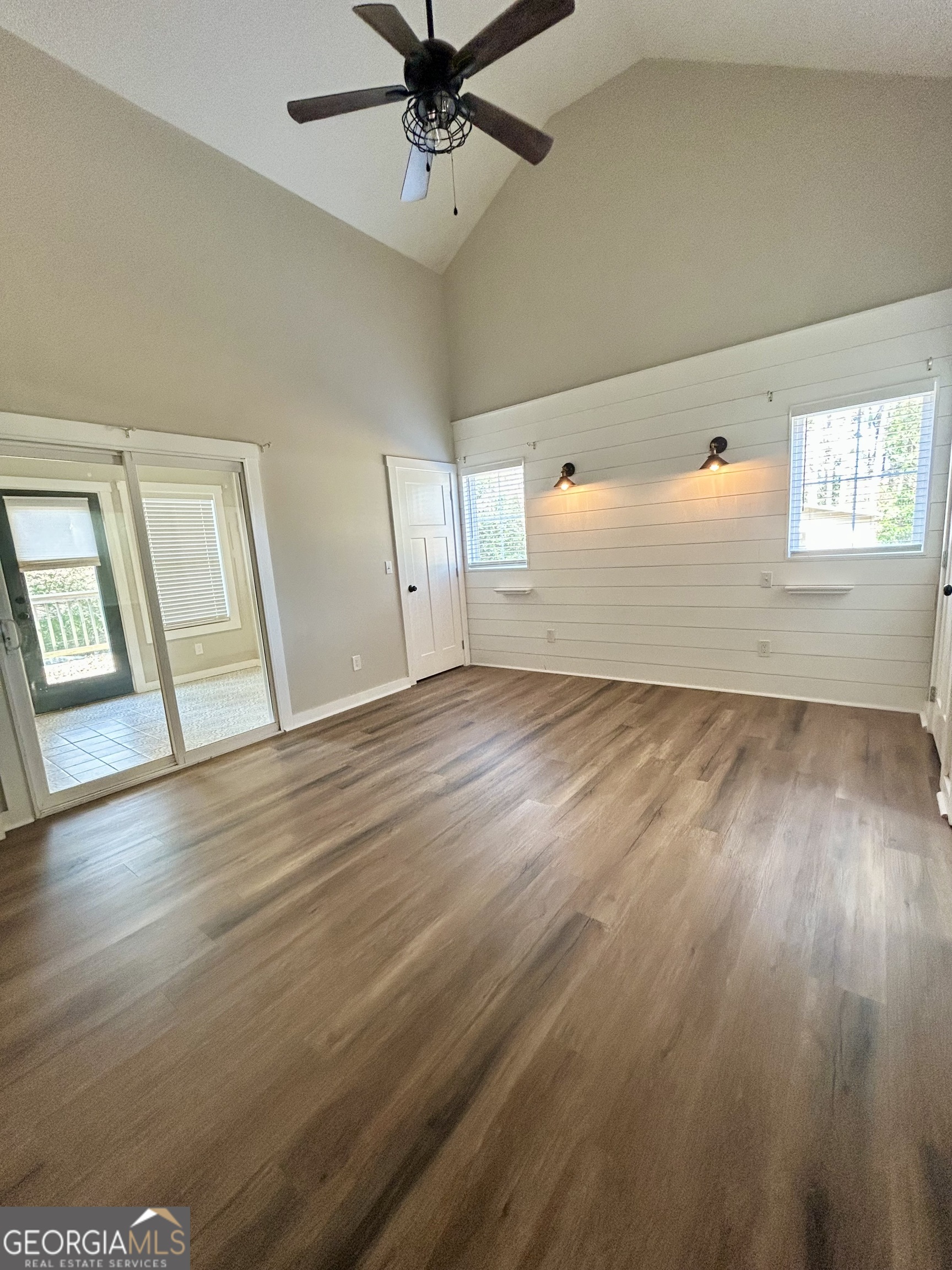 117 Marchman Street Bremen, GA 30110 - Photo 25 of 38 an empty room with wooden floor fan and windows