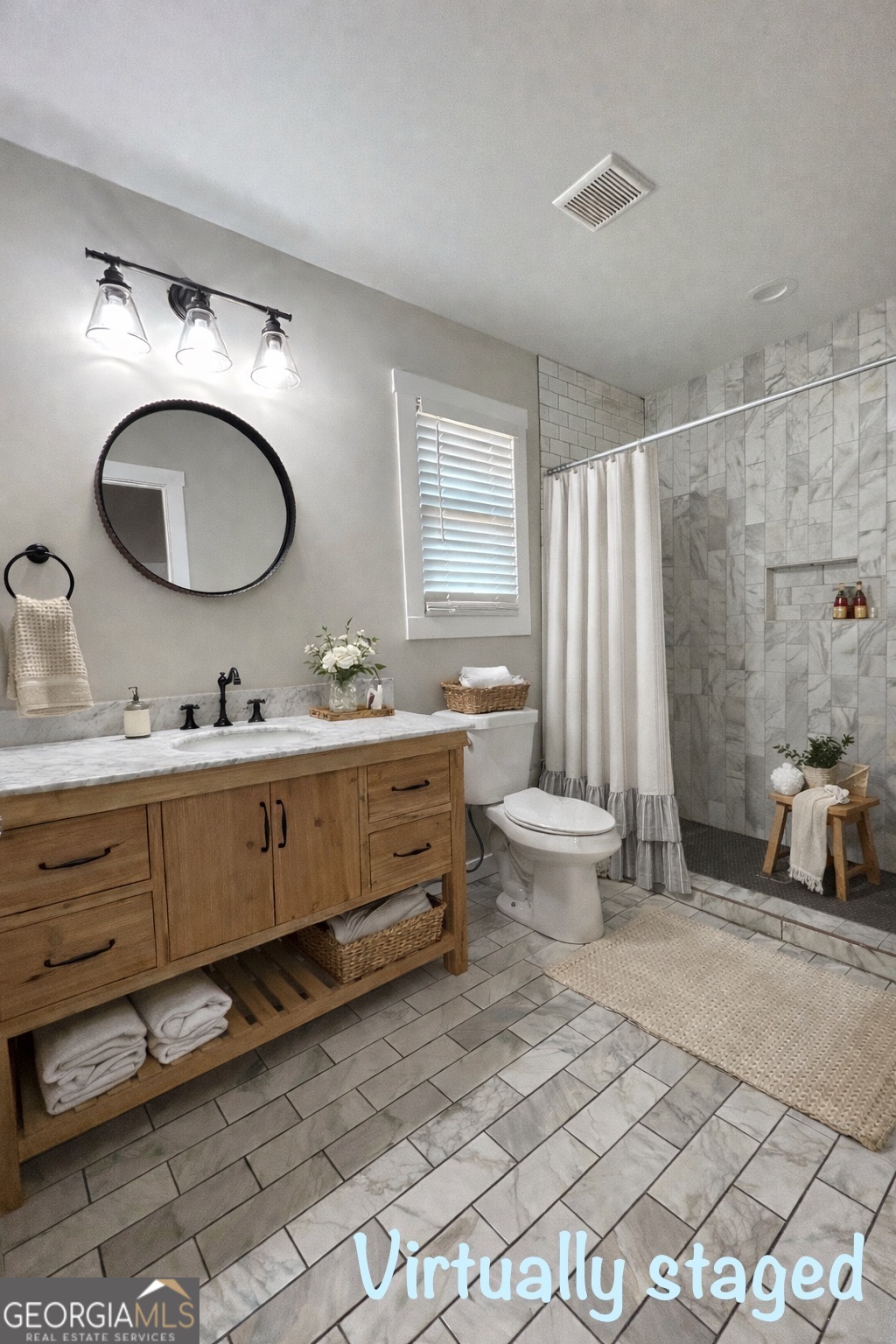 117 Marchman Street Bremen, GA 30110 - Photo 30 of 38 a bathroom with a toilet sink mirror and vanity