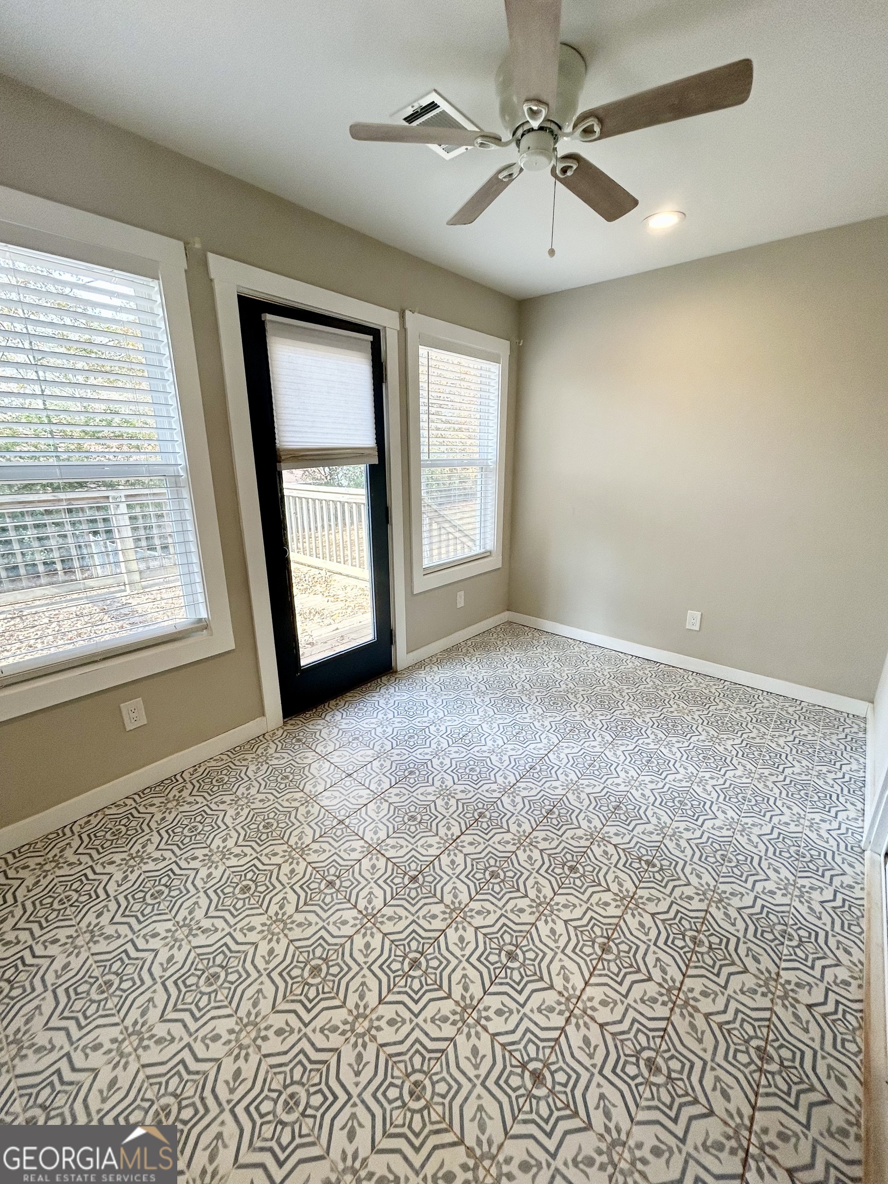 117 Marchman Street Bremen, GA 30110 - Photo 32 of 38 a view of an empty room with a window and a kitchen