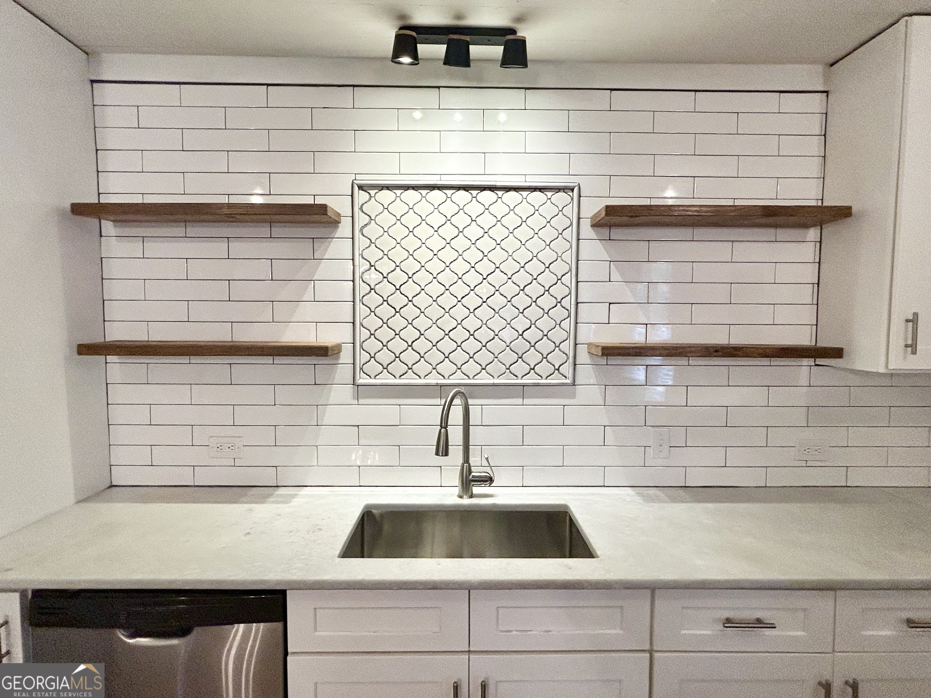 117 Marchman Street Bremen, GA 30110 - Photo 7 of 38 a kitchen with a sink and a window