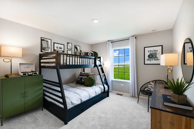 a bedroom with furniture and a window