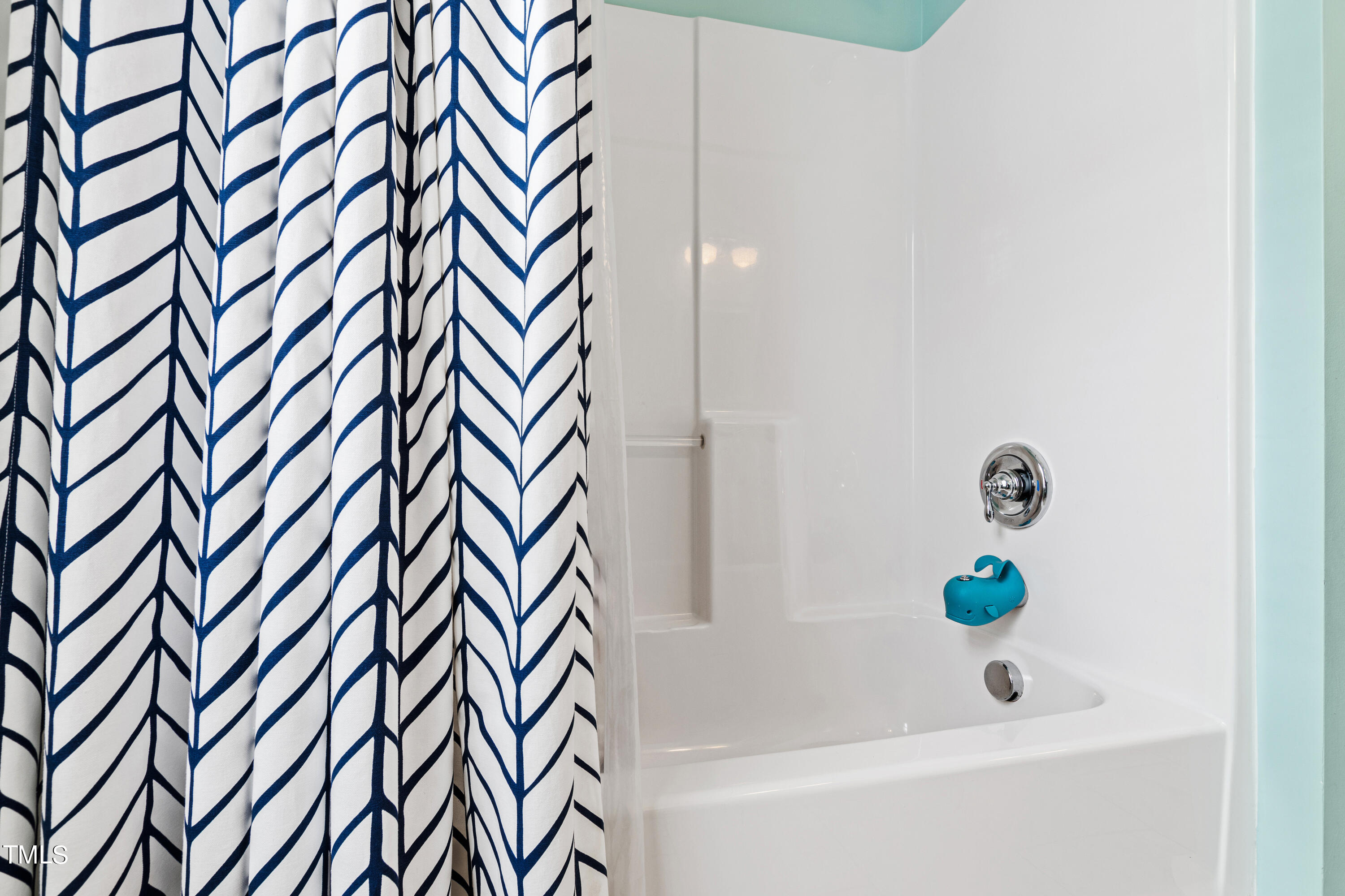 515 Pace Street Raleigh, NC 27604 - Photo 46 of 54 a bathroom with a bathtub and a shower curtain
