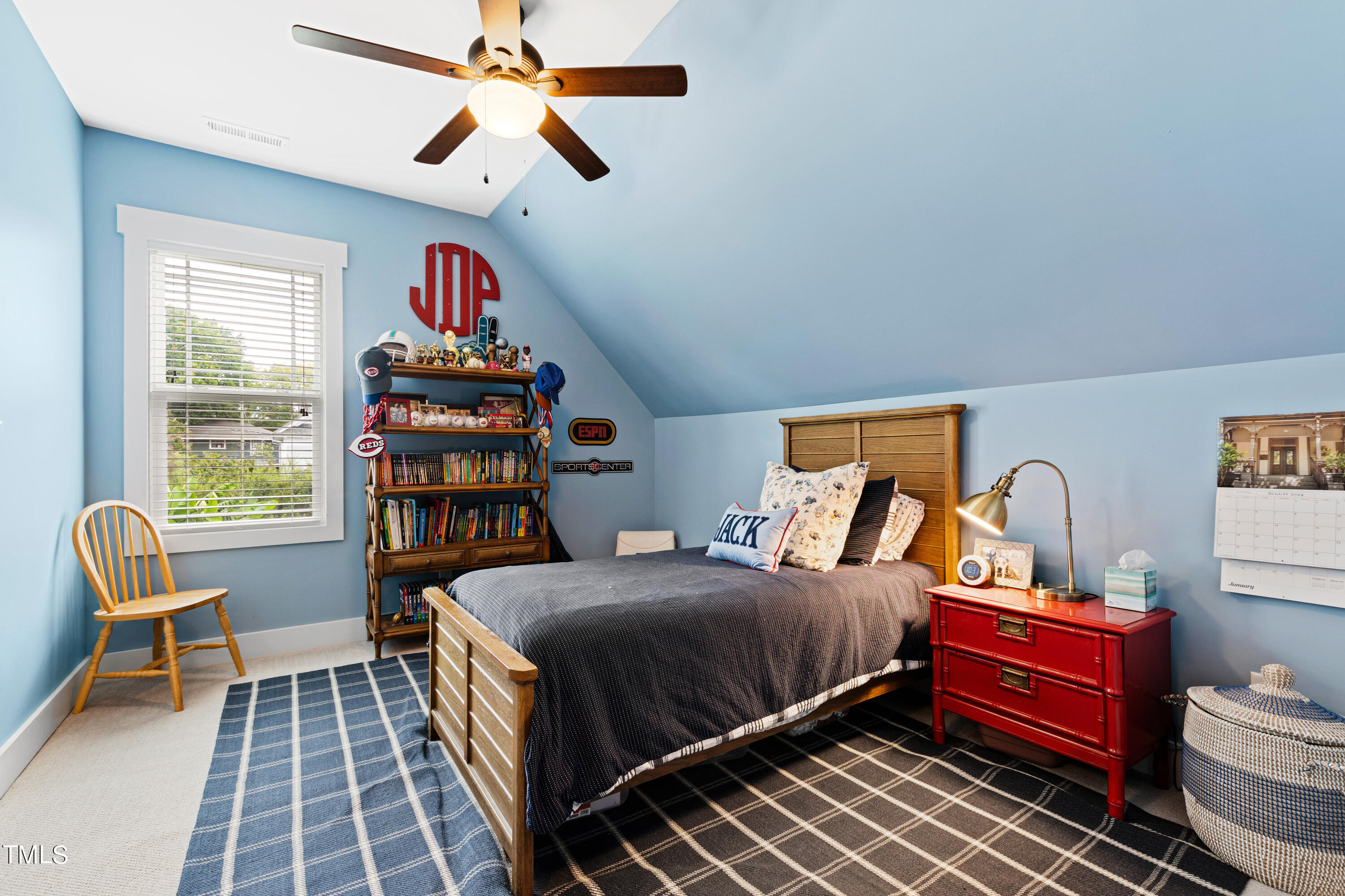 515 Pace Street Raleigh, NC 27604 - Photo 51 of 54 a bedroom with a bed and a chandelier