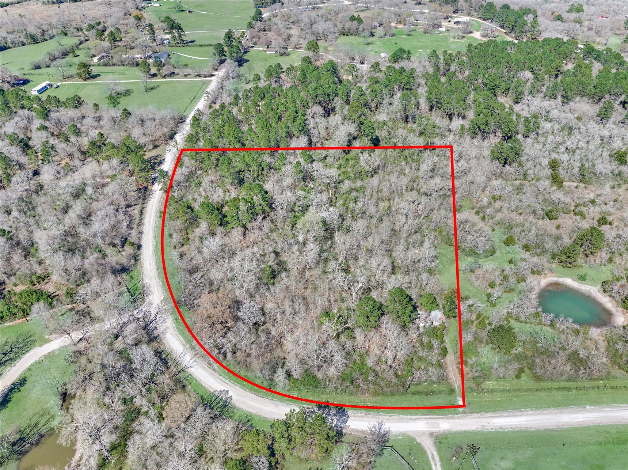 0 Piney Point Road Huntsville, TX 77340 - Photo 2 of 11 a view of a wooden fence