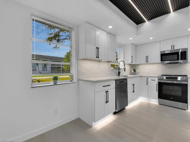 a bathroom with a shower and a sink