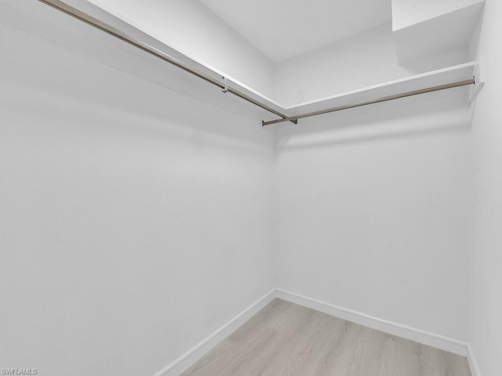 4941 Aztec Circle Naples, FL 34112 - Photo 19 of 36 a empty walk in closet
