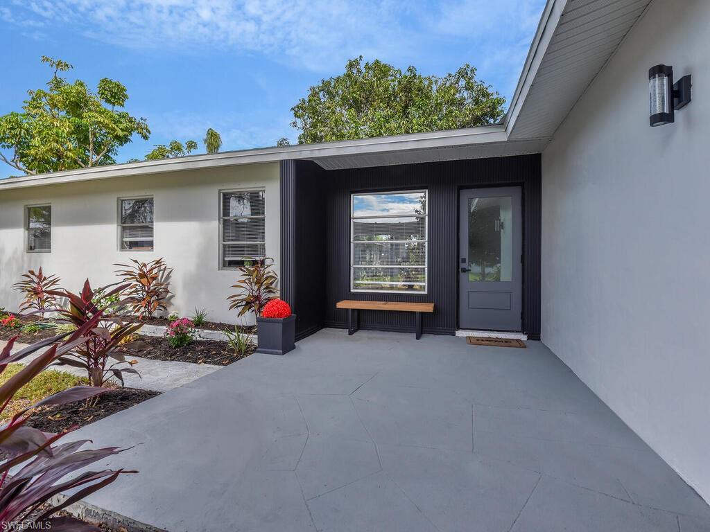 4941 Aztec Circle Naples, FL 34112 - Photo 2 of 36 front view of a house with an outdoor space
