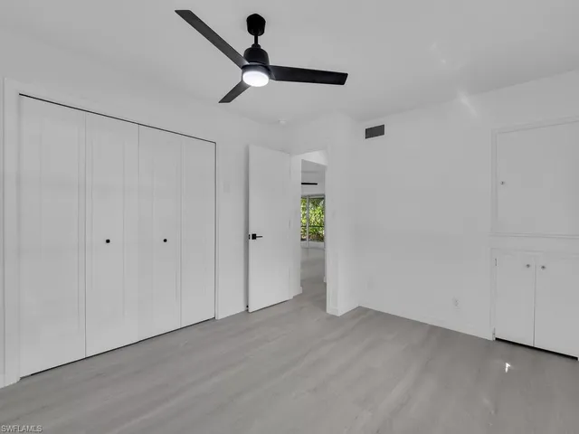 a bathroom with a granite countertop sink mirror and bathtub