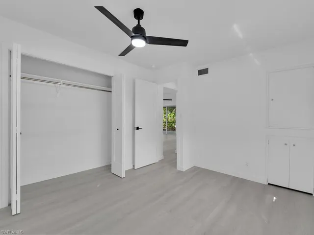 a living room with furniture and painting on the wall