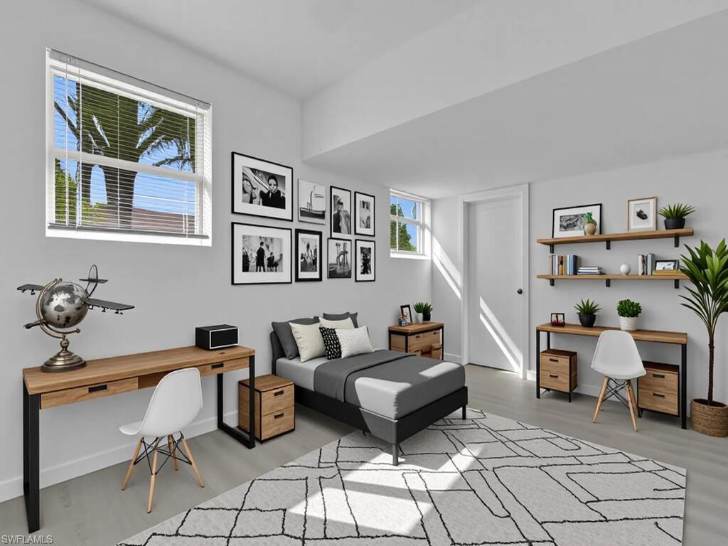 4941 Aztec Circle Naples, FL 34112 - Photo 24 of 36 a living room with furniture and painting on the wall