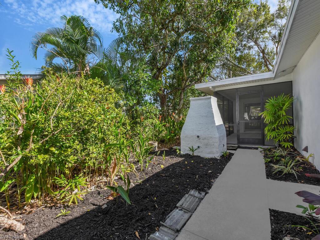 4941 Aztec Circle Naples, FL 34112 - Photo 33 of 36 a backyard of a house with lots of green space