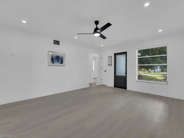 a view of a livingroom with furniture and window