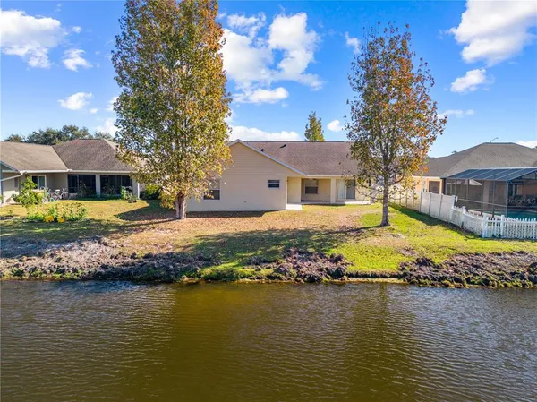an aerial view of a house with a swimming pool