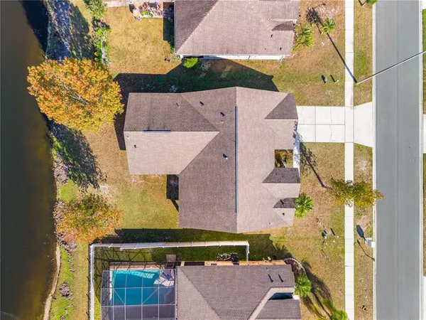 a view of a swimming pool with an outdoor seating and a garden