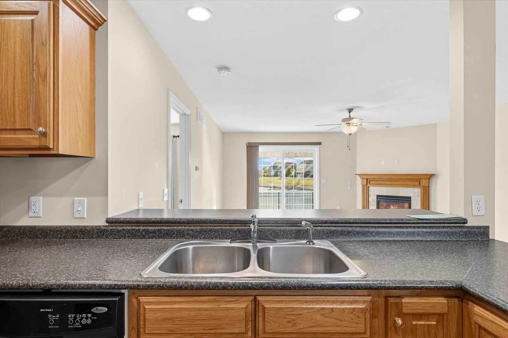 2208 Cyprus Point, Unit 2208 Urbana, IL 61802 - Photo 11 of 30 a kitchen with granite countertop a sink and cabinets
