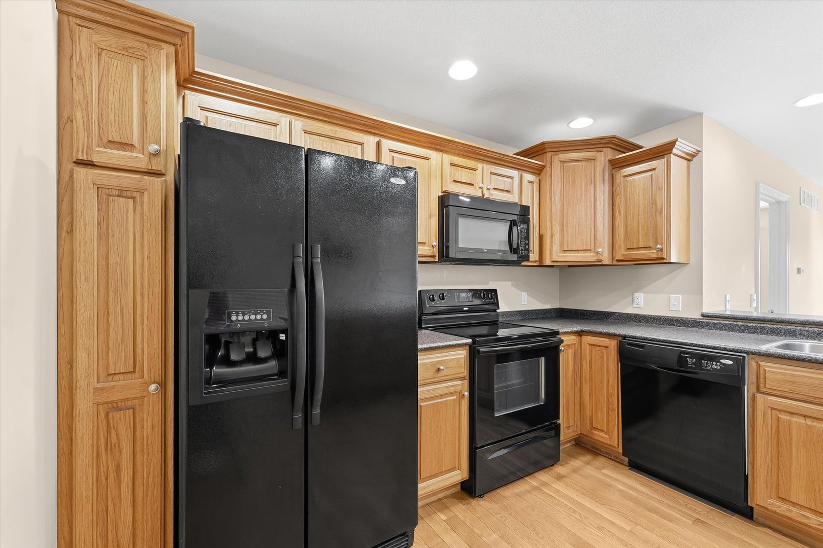 2208 Cyprus Point, Unit 2208 Urbana, IL 61802 - Photo 12 of 30 a kitchen with stainless steel appliances granite countertop a refrigerator stove and sink