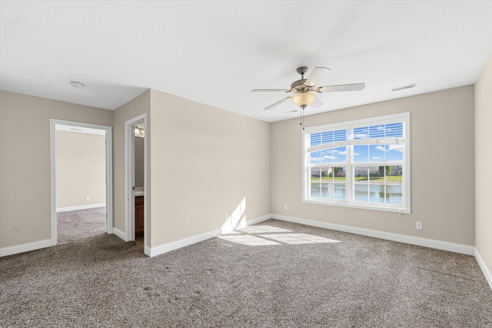 2208 Cyprus Point, Unit 2208 Urbana, IL 61802 - Photo 20 of 30 a view of an empty room with a window