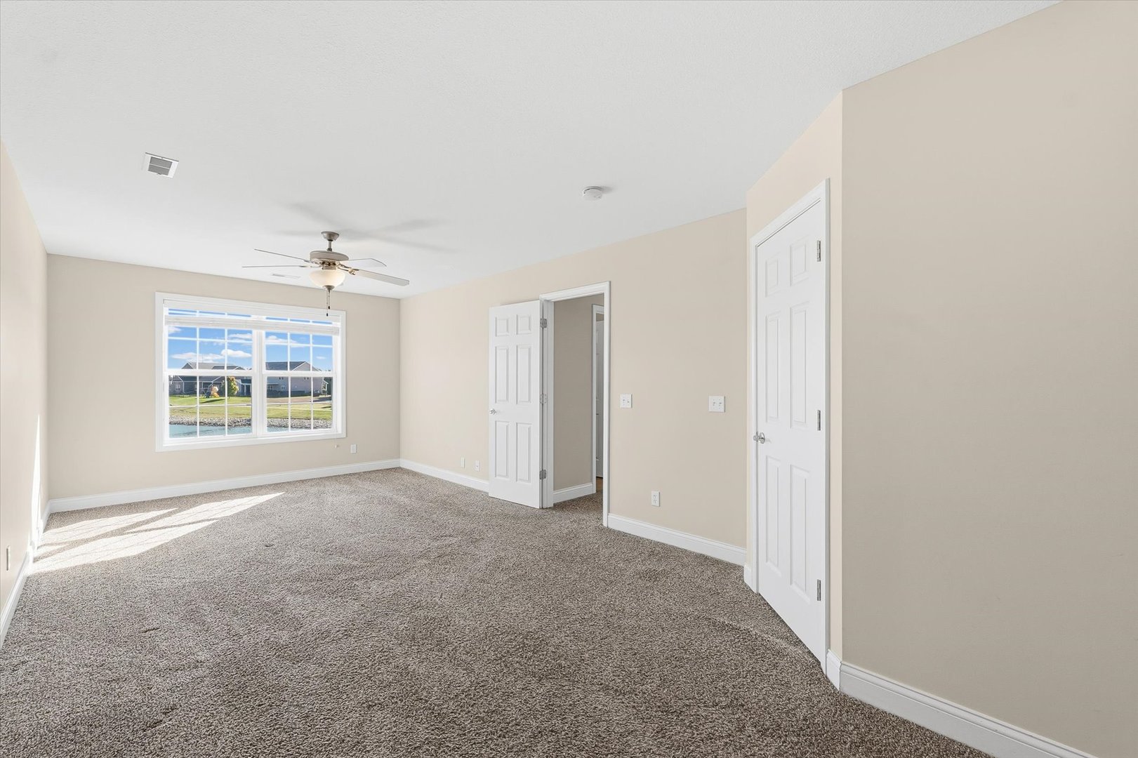 2208 Cyprus Point, Unit 2208 Urbana, IL 61802 - Photo 23 of 30 a view of an empty room with a window