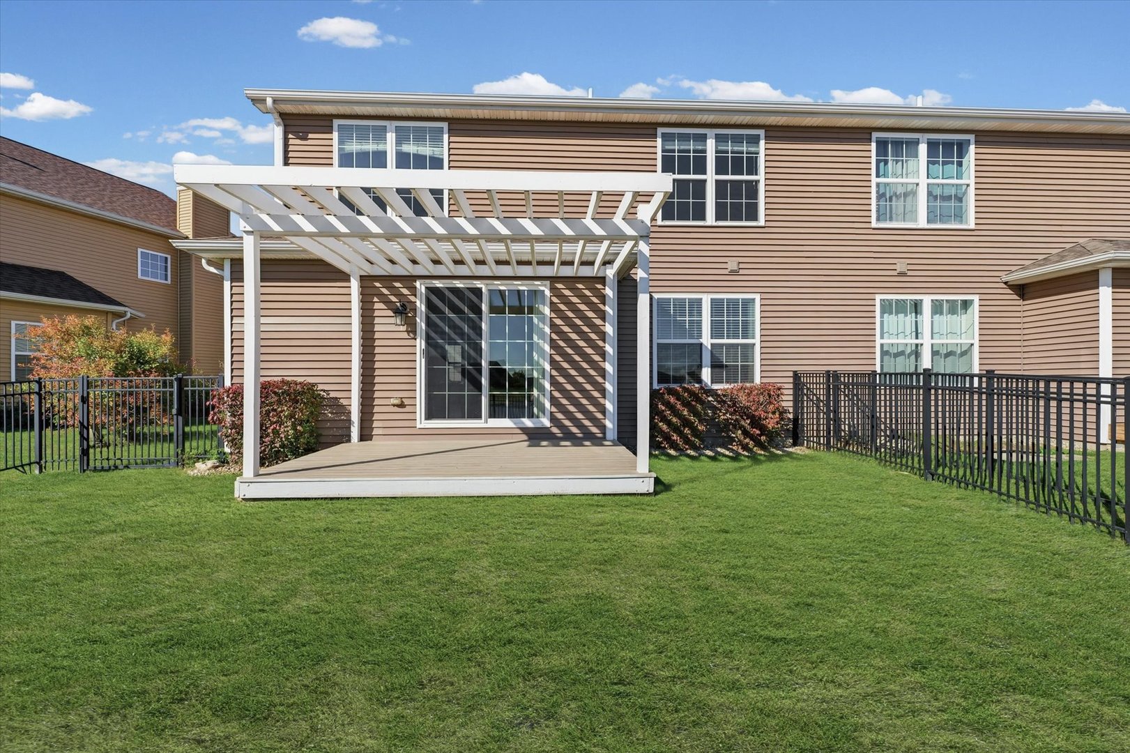 2208 Cyprus Point, Unit 2208 Urbana, IL 61802 - Photo 28 of 30 a view of a house with backyard and porch