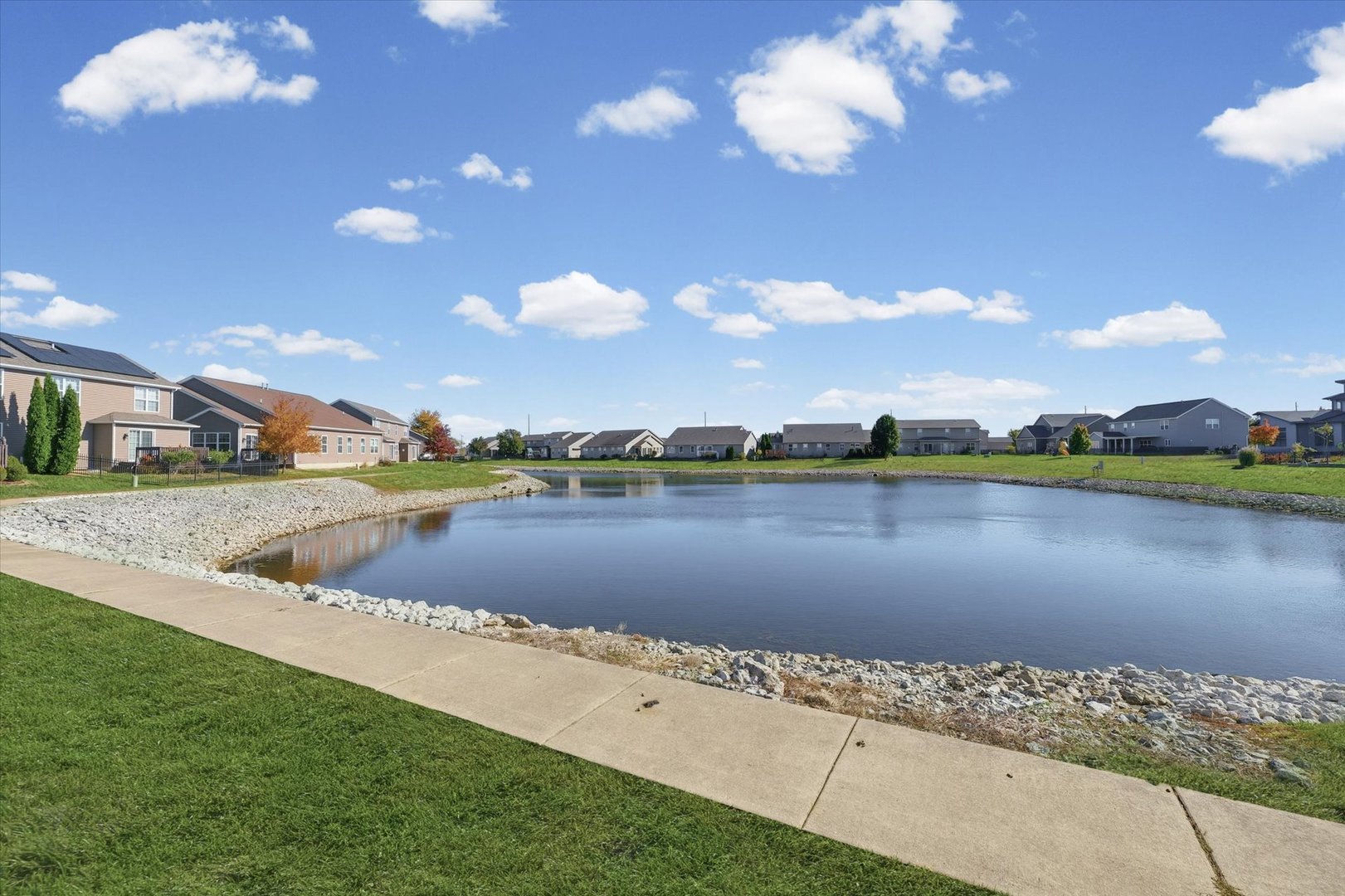 2208 Cyprus Point, Unit 2208 Urbana, IL 61802 - Photo 29 of 30 a view of a lake with houses