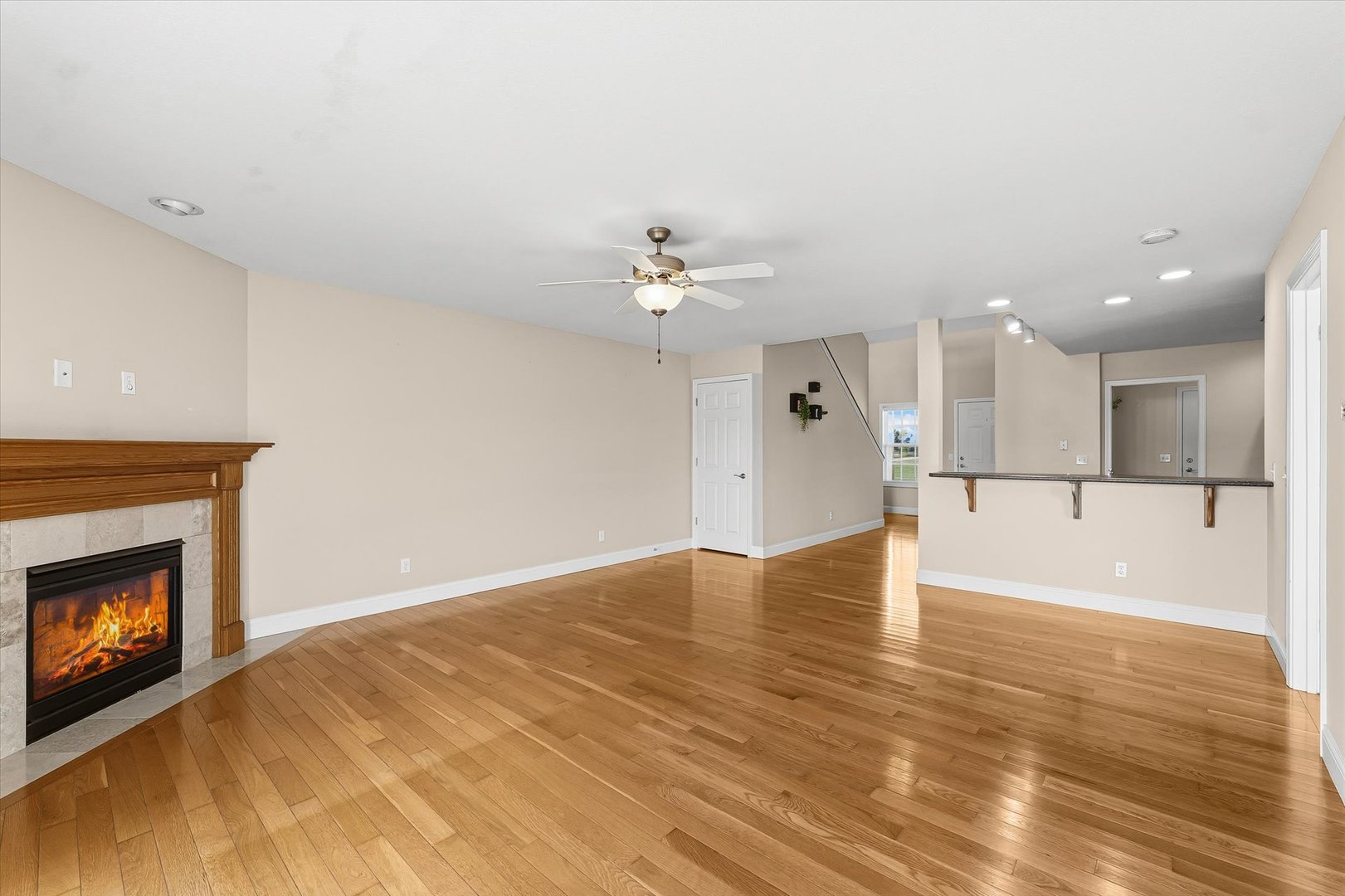 2208 Cyprus Point, Unit 2208 Urbana, IL 61802 - Photo 6 of 30 a view of a kitchen with a sink and a fireplace