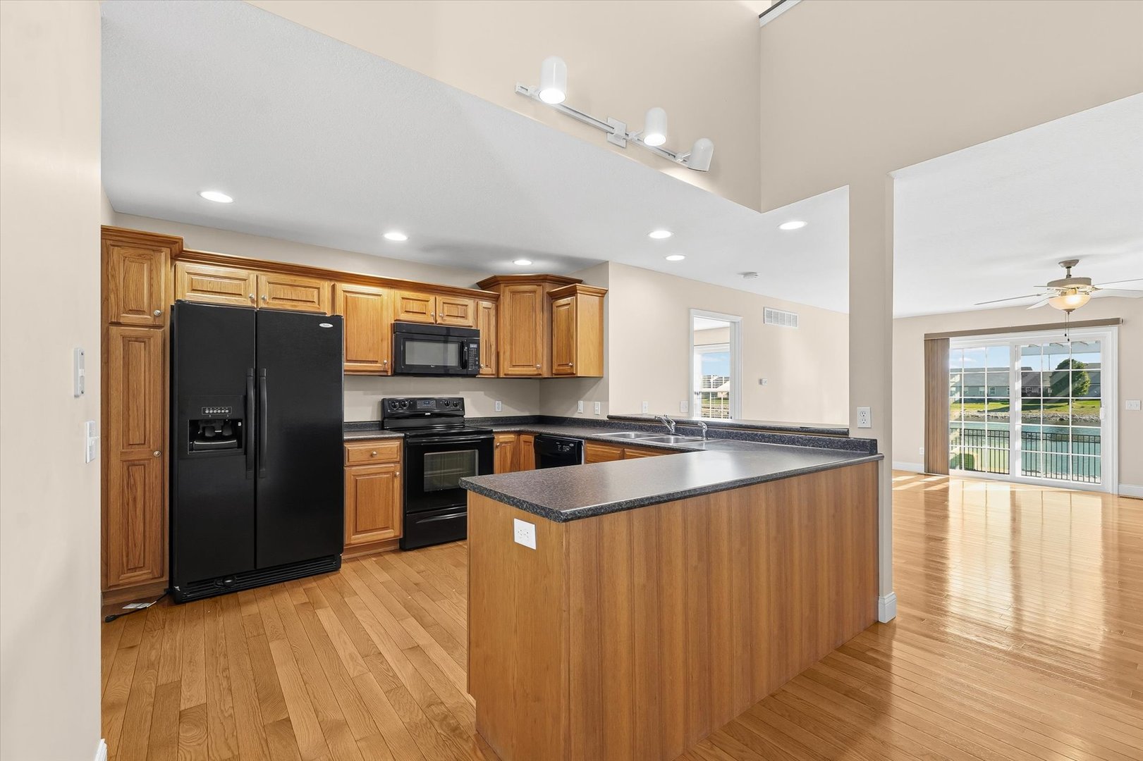 2208 Cyprus Point, Unit 2208 Urbana, IL 61802 - Photo 9 of 30 a large kitchen with stainless steel appliances granite countertop a refrigerator a sink a stove and oven