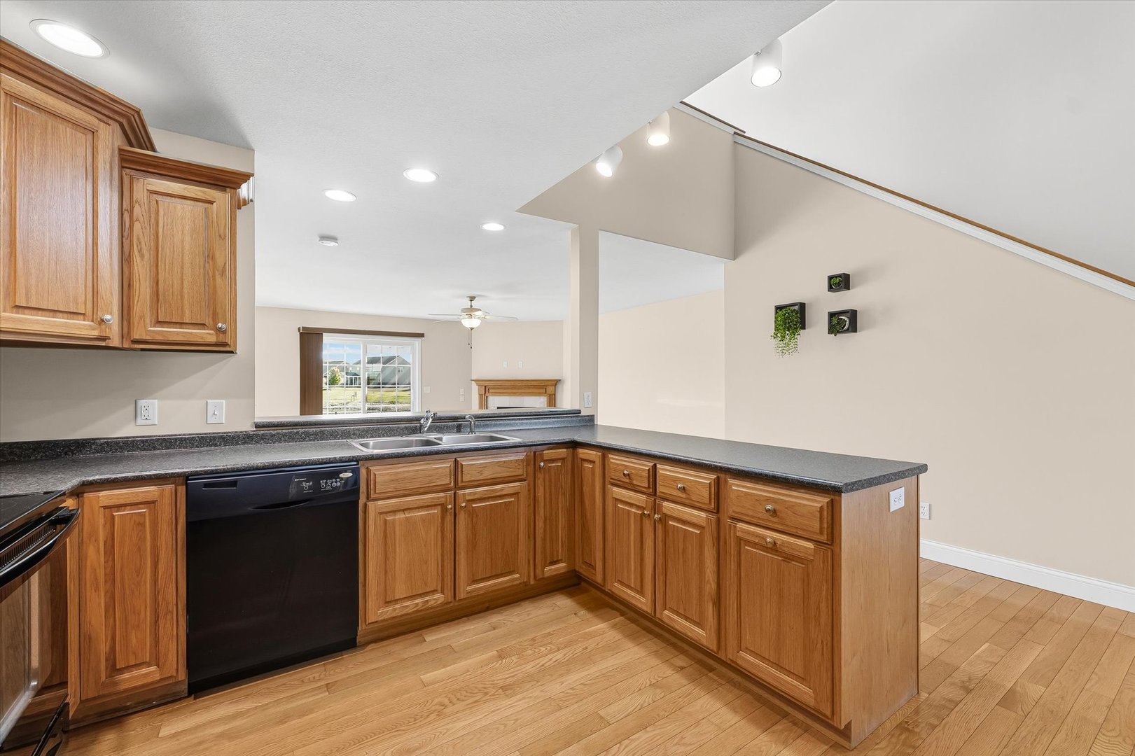 2208 Cyprus Point, Unit 2208 Urbana, IL 61802 - Photo 10 of 30 a kitchen with granite countertop sink stove and cabinets