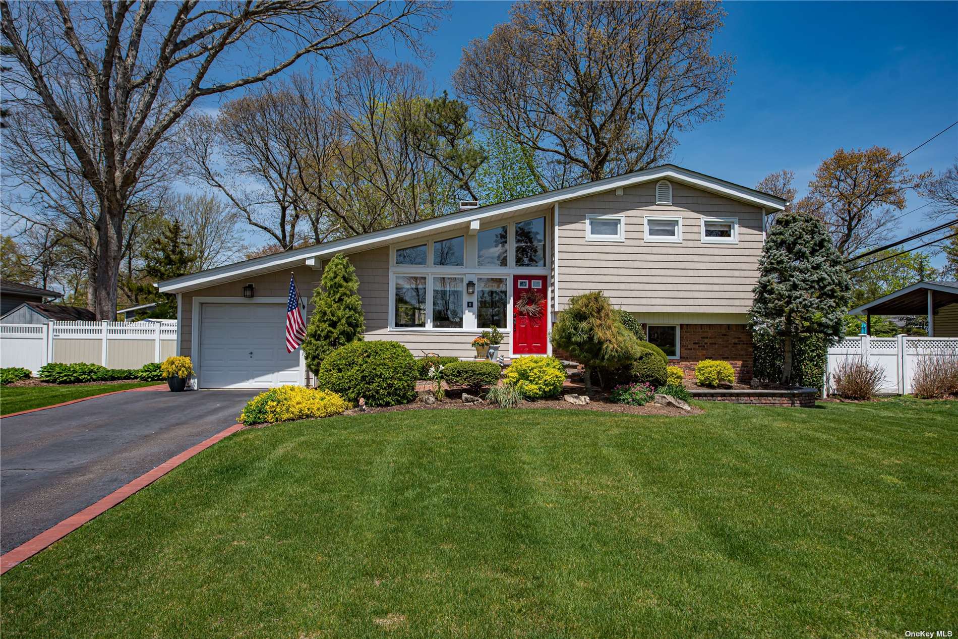 11 Brilner Drive Smithtown, NY 11787 - Photo 1 of 1 a front view of house with yard and green space