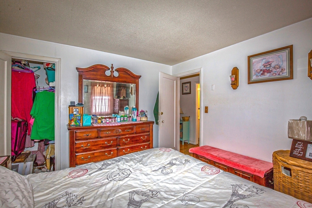 31 Colony Road, Unit 31 West Springfield, MA 01089 - Photo 13 of 20 a bed room with a bed and a mirror
