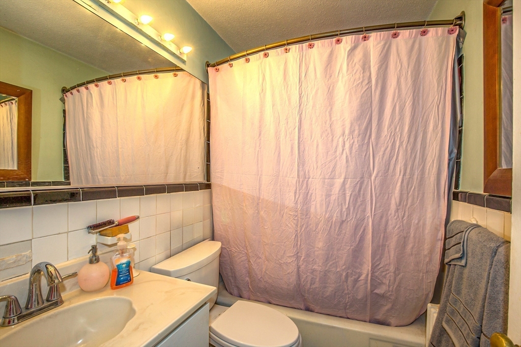 31 Colony Road, Unit 31 West Springfield, MA 01089 - Photo 16 of 20 a bathroom with a sink and a mirror
