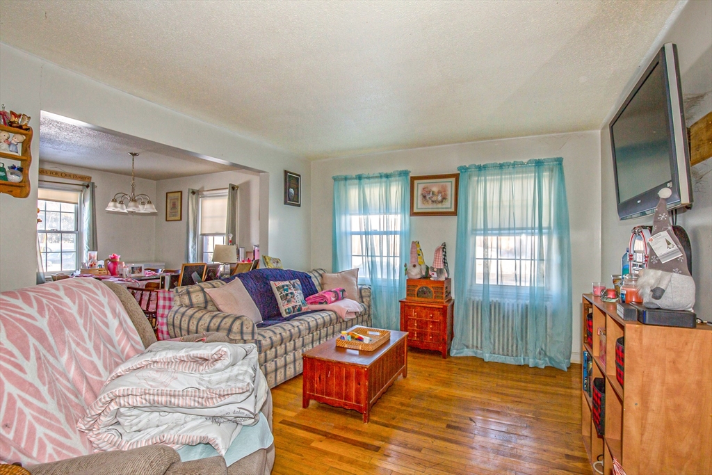 31 Colony Road, Unit 31 West Springfield, MA 01089 - Photo 5 of 20 a living room with furniture and a flat screen tv