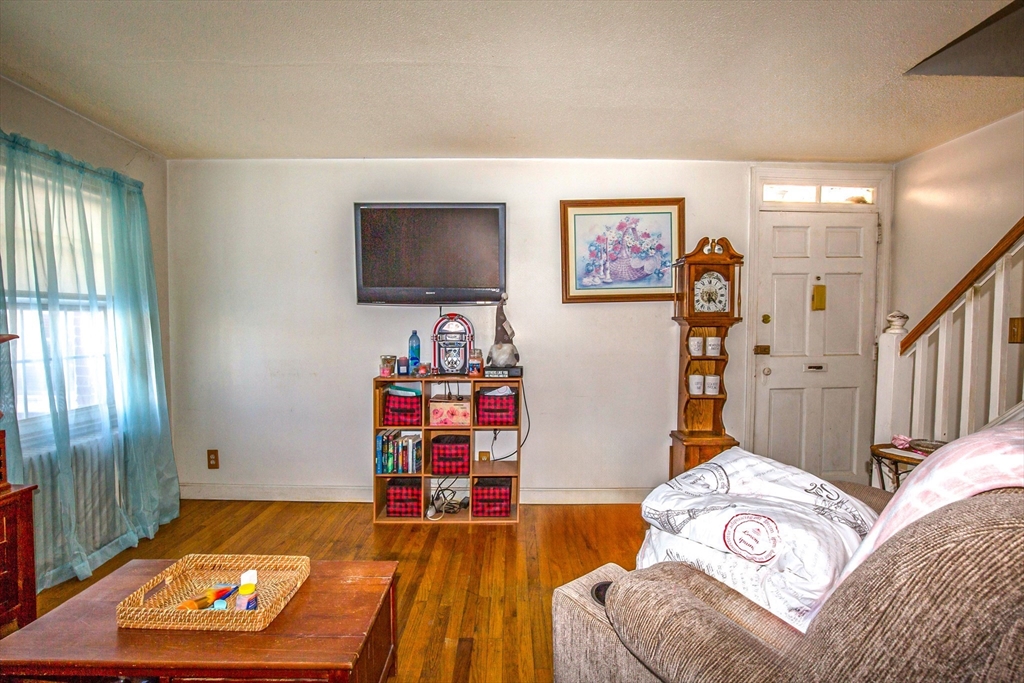 31 Colony Road, Unit 31 West Springfield, MA 01089 - Photo 6 of 20 a living room with furniture and a flat screen tv
