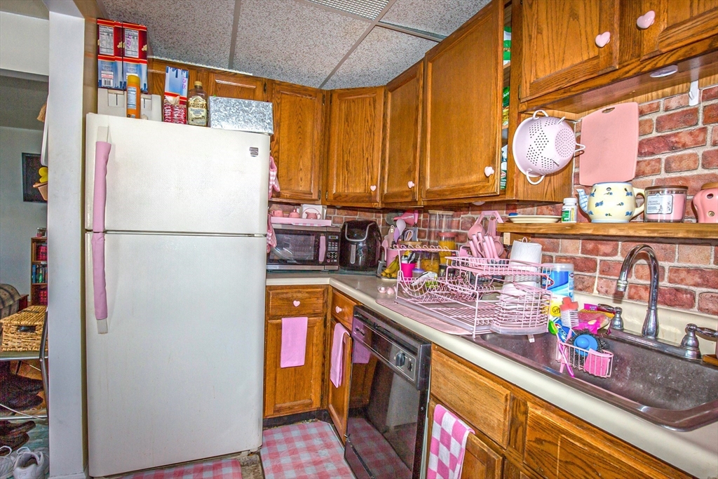 31 Colony Road, Unit 31 West Springfield, MA 01089 - Photo 10 of 20 a kitchen with stainless steel appliances granite countertop a refrigerator a stove and a sink with dishwasher