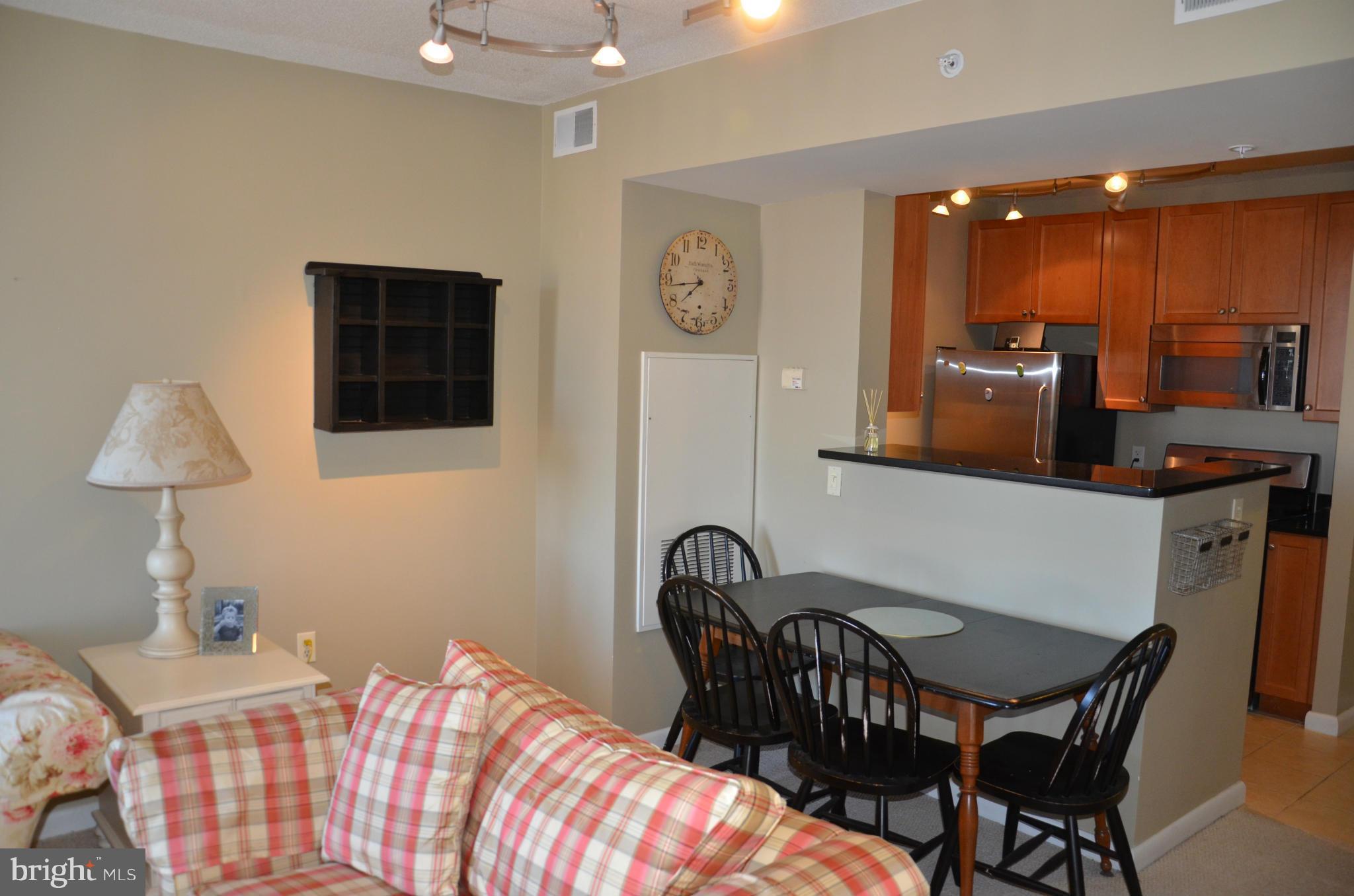 851 North Glebe Road, Unit 1116 Arlington, VA 22203 - Photo 11 of 30 a bedroom with furniture and wooden floor
