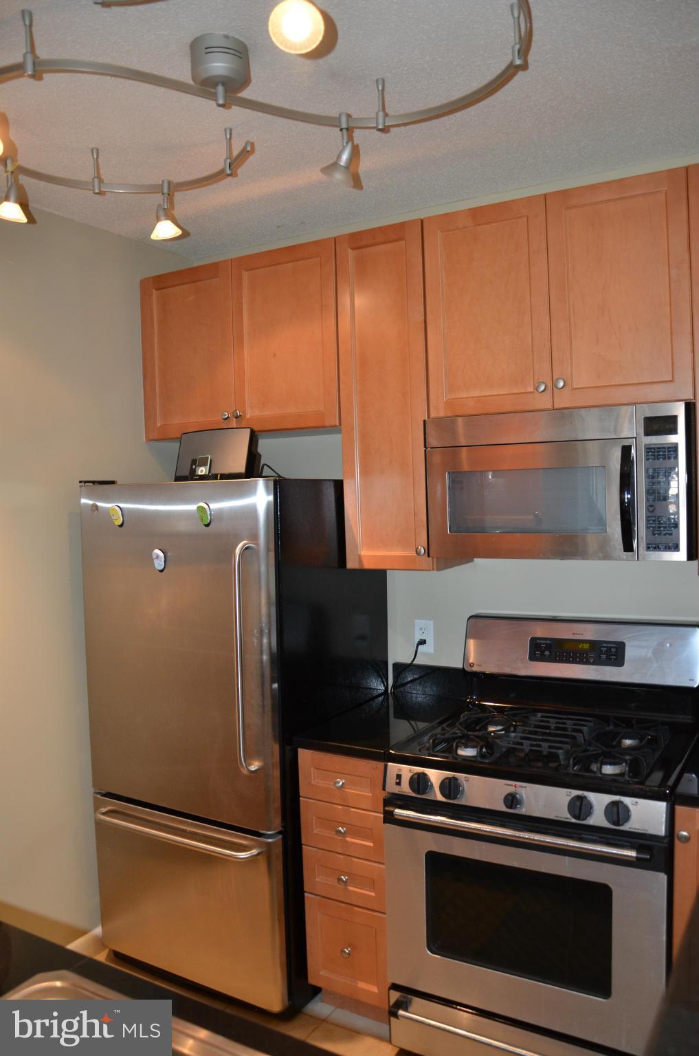 851 North Glebe Road, Unit 1116 Arlington, VA 22203 - Photo 14 of 30 a stove top oven sitting inside of a kitchen