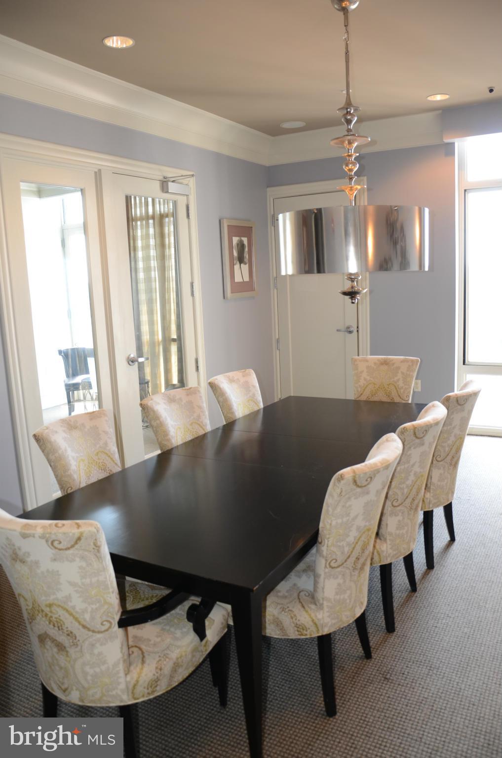 851 North Glebe Road, Unit 1116 Arlington, VA 22203 - Photo 25 of 30 a view of a dining room with furniture and wooden floor